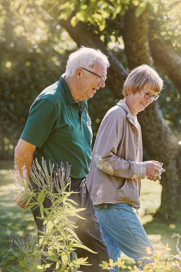 Residents walking around Merrill Gardens at West Chester