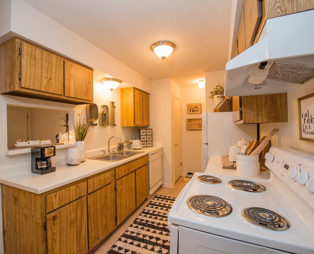 Kitchen with white appliances at Waters Edge in Oklahoma City, Oklahoma