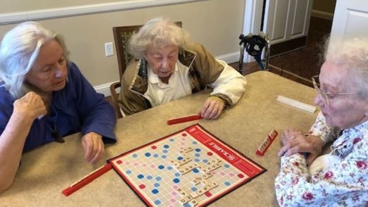 Elderly playing scrabble