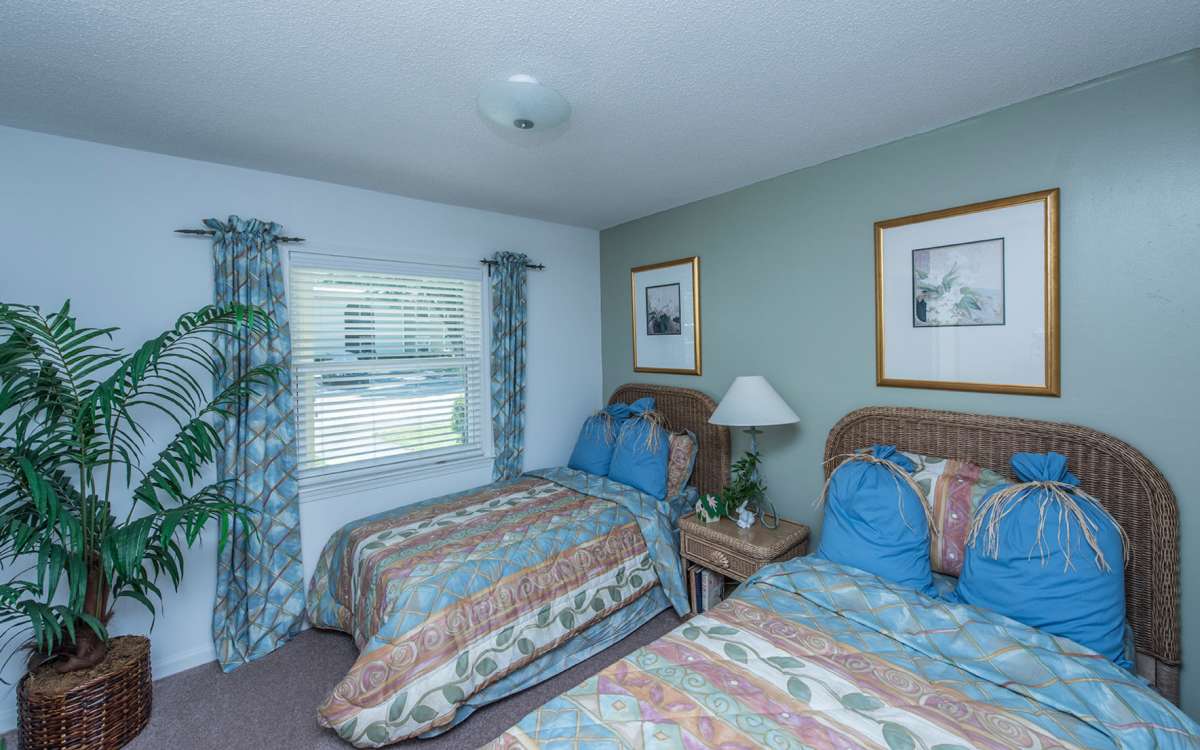 Model bedroom with two beds at Anchorage in Mount Pleasant, South Carolina