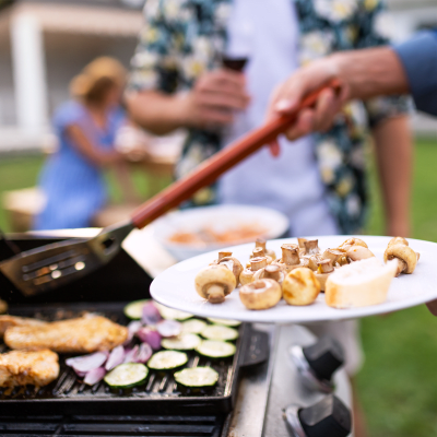 Residents grilling food during a community event at South Mesa II in Oceanside, California