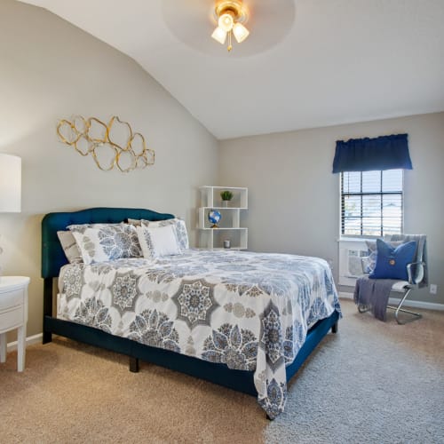 A furnished bedroom at Vesta Creeks Run in North Charleston, South Carolina