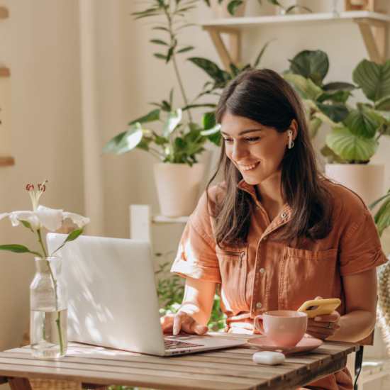 Resident using online rental payment in her laptop at City's Edge in Pittsburgh, Pennsylvania