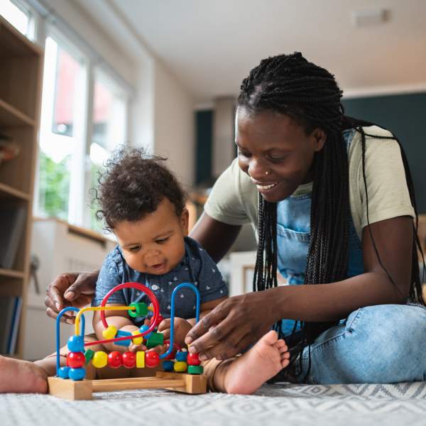 Resident playing with her son in her apartment at Alexander Pointe Apartments in Maineville, Ohio