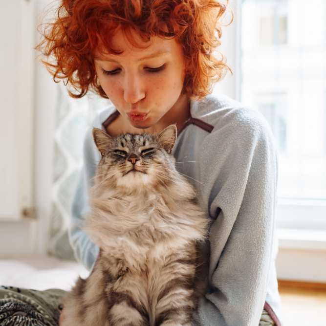 Resident playing with her cat at Hudson Carolina Forest in Myrtle Beach, South Carolina