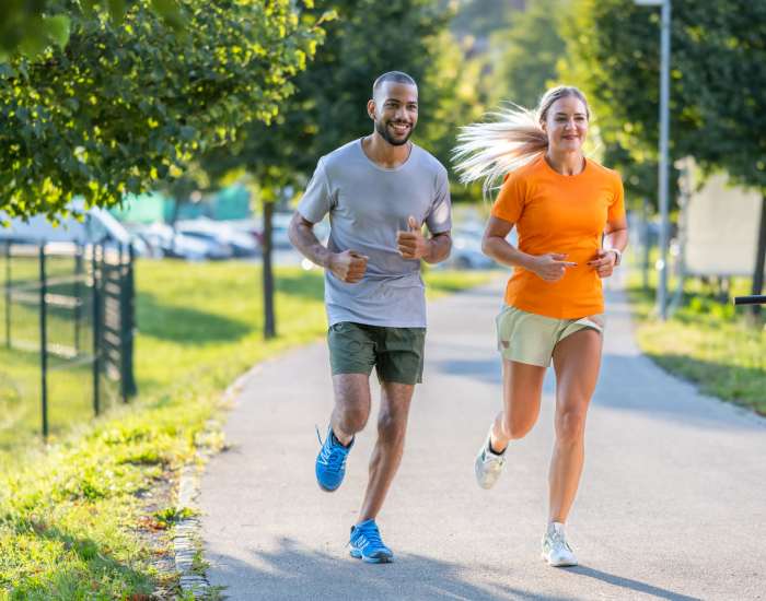 A resident couple jogging on a path in a park located near Crown Point, Indiana