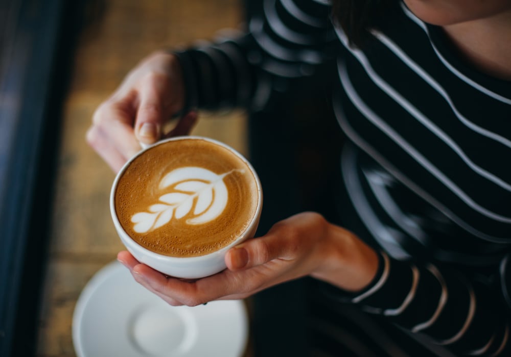 Resident enjoying a cup of coffee at Division Terrace in Portland, Oregon