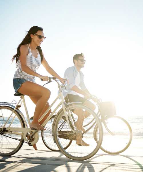 Residents riding their bike on the beach at Parc at Broad River in Beaufort, South Carolina