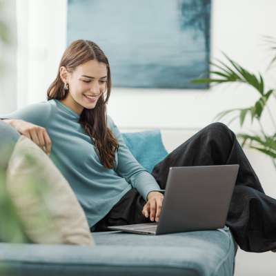 Resident working in laptop at Luxe Villas in Brentwood, California