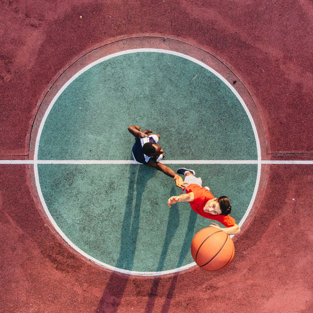 Residents playing basketball at Villa De Oro in San Antonio, Texas