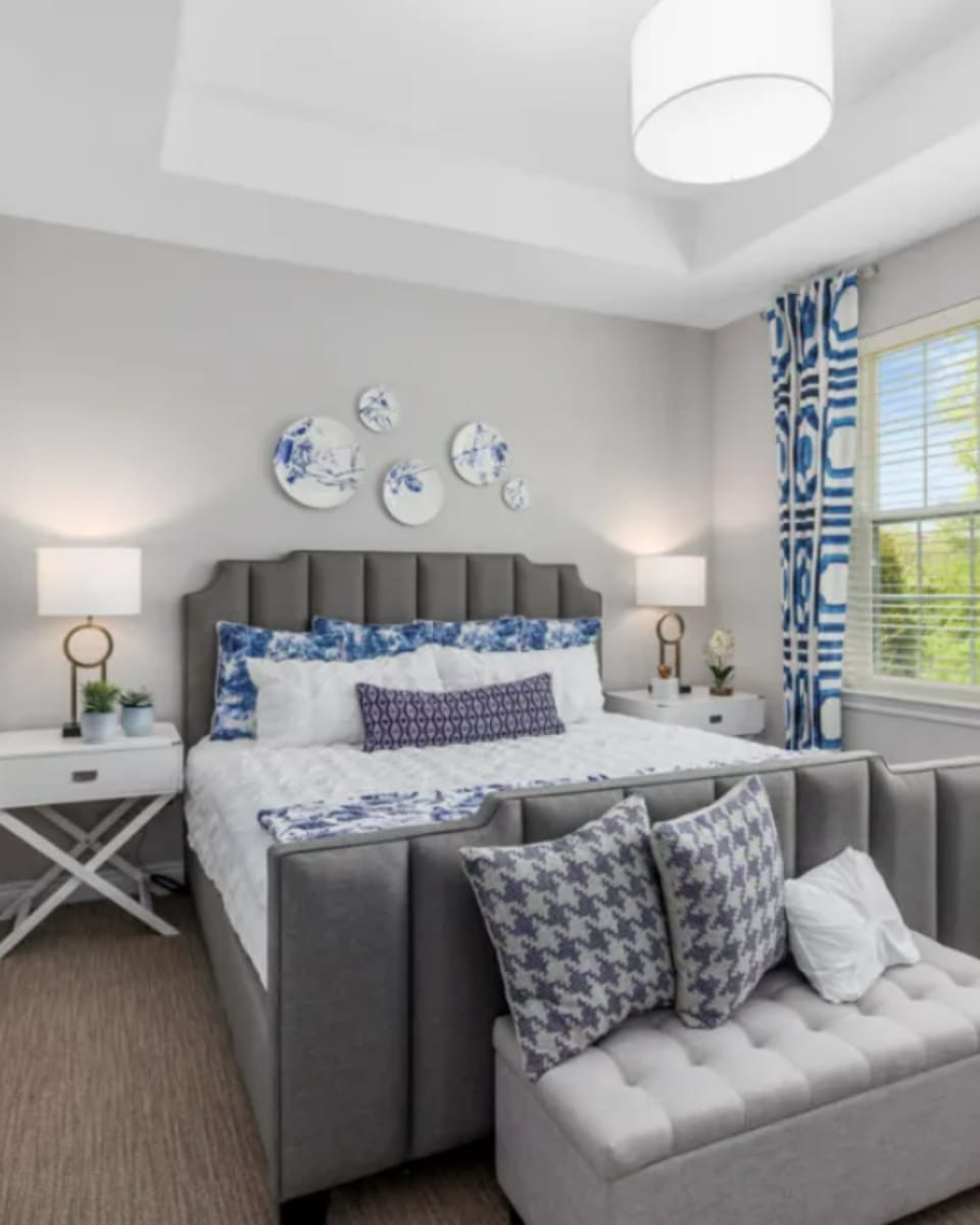 Modern decor in a model home's bedroom at Encore at West Valley in White Lake, Michigan