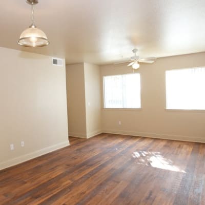 A living room with wood flooring in a home at San Onofre II in San Clemente, California