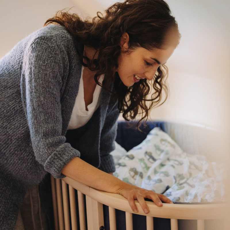 A mother puts her baby to sleep at Magnolia Run, Virginia Beach, Virginia