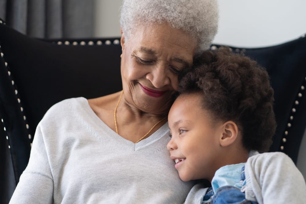 A resident with her granddaughter at Regency Palms Colton in Colton, California.