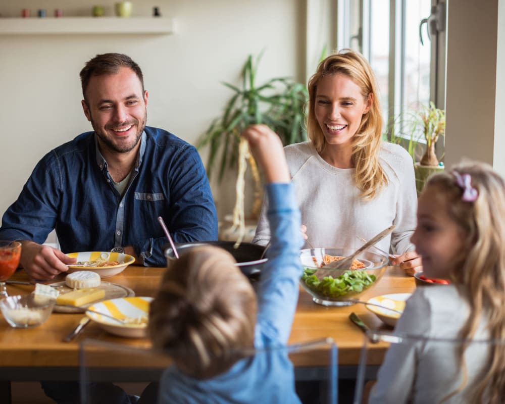 A happy family eating their meal near Wood Road in Annapolis, Maryland