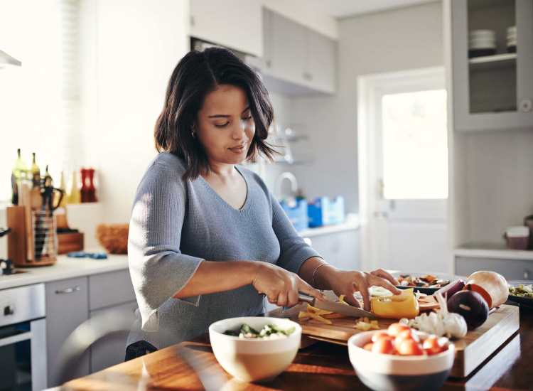 Resident cooking at 270 Centre Street in Jamaica Plain, Massachusetts