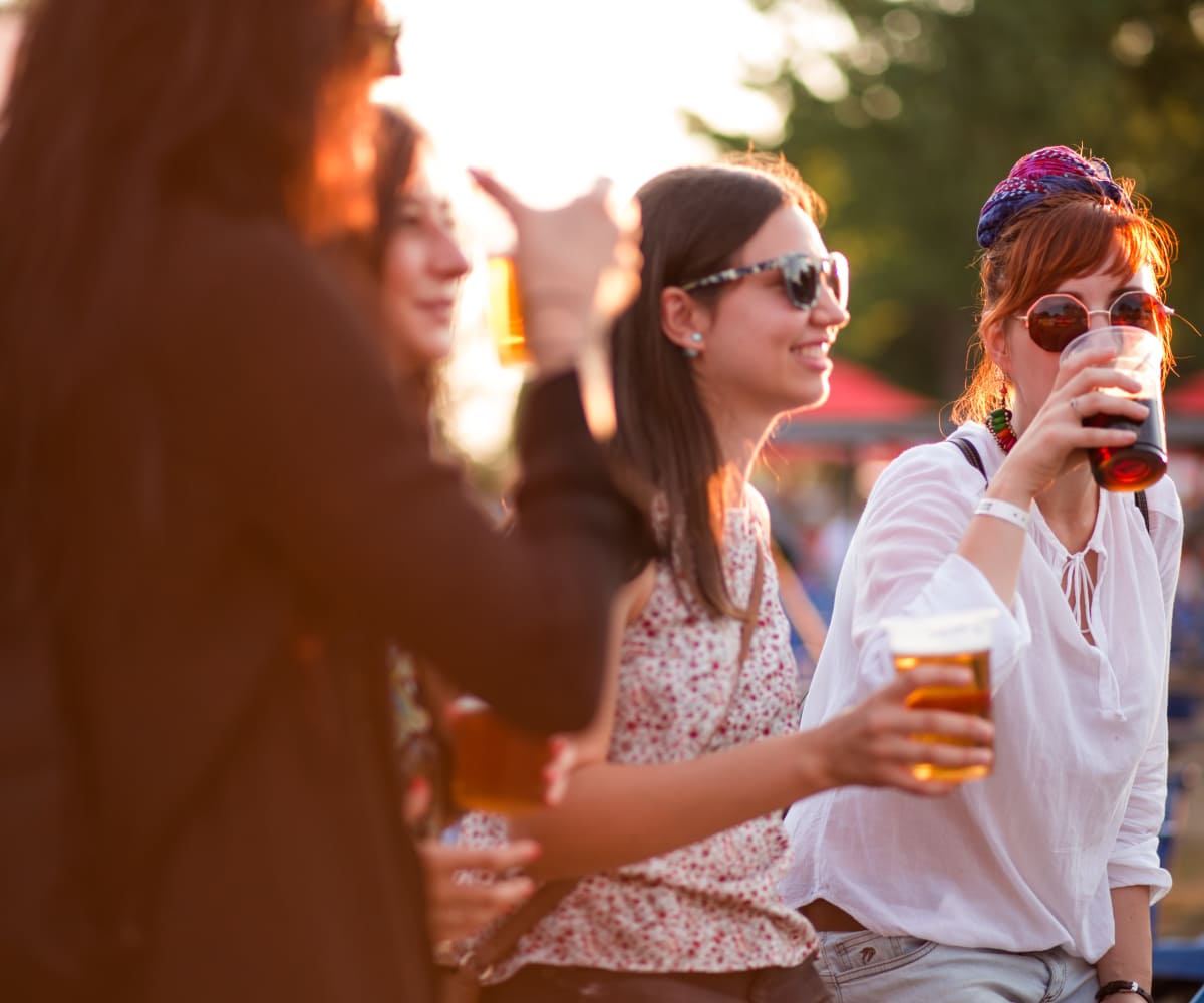 Friends enjoying a drink at Persimmon Square Apartments in Oklahoma City, Oklahoma