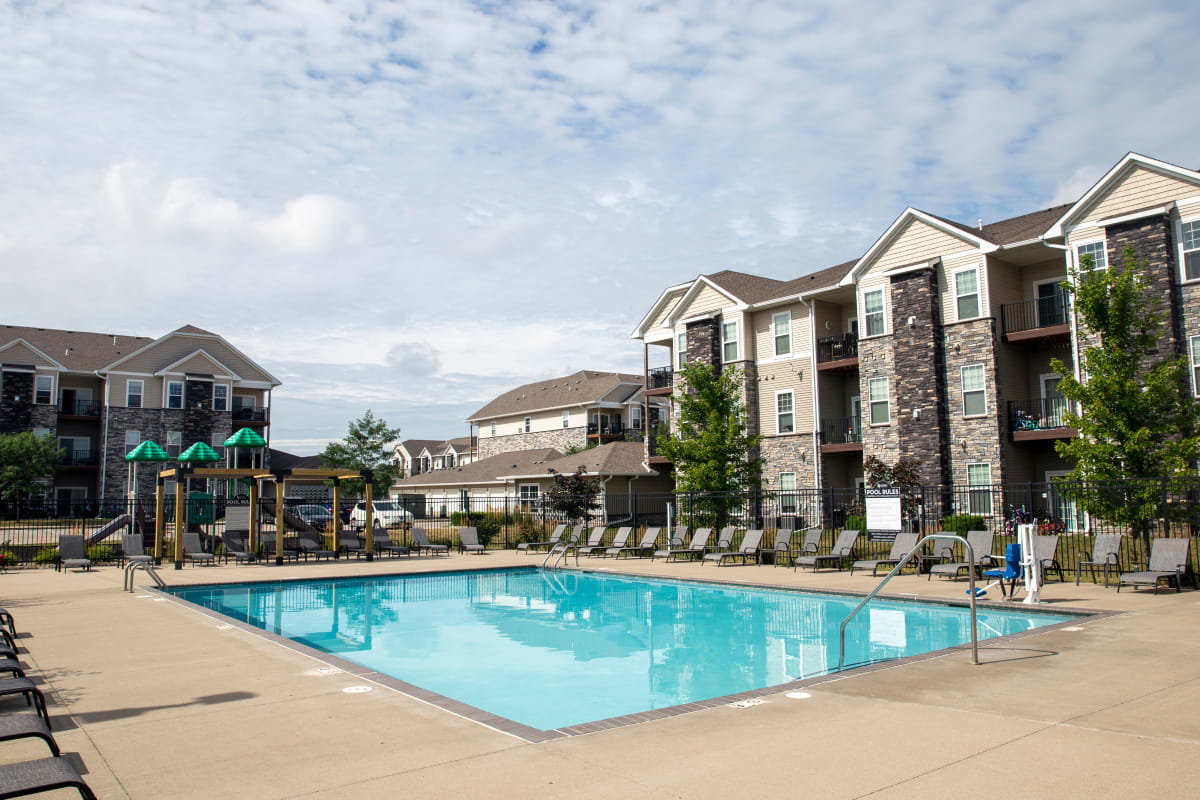 Large community pool with pool side seating at Ironwood in Altoona, Iowa