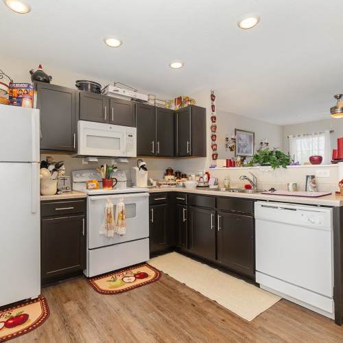 A kitchen with white colored appliances at Towne Creek Crossing in Walton, Kentucky