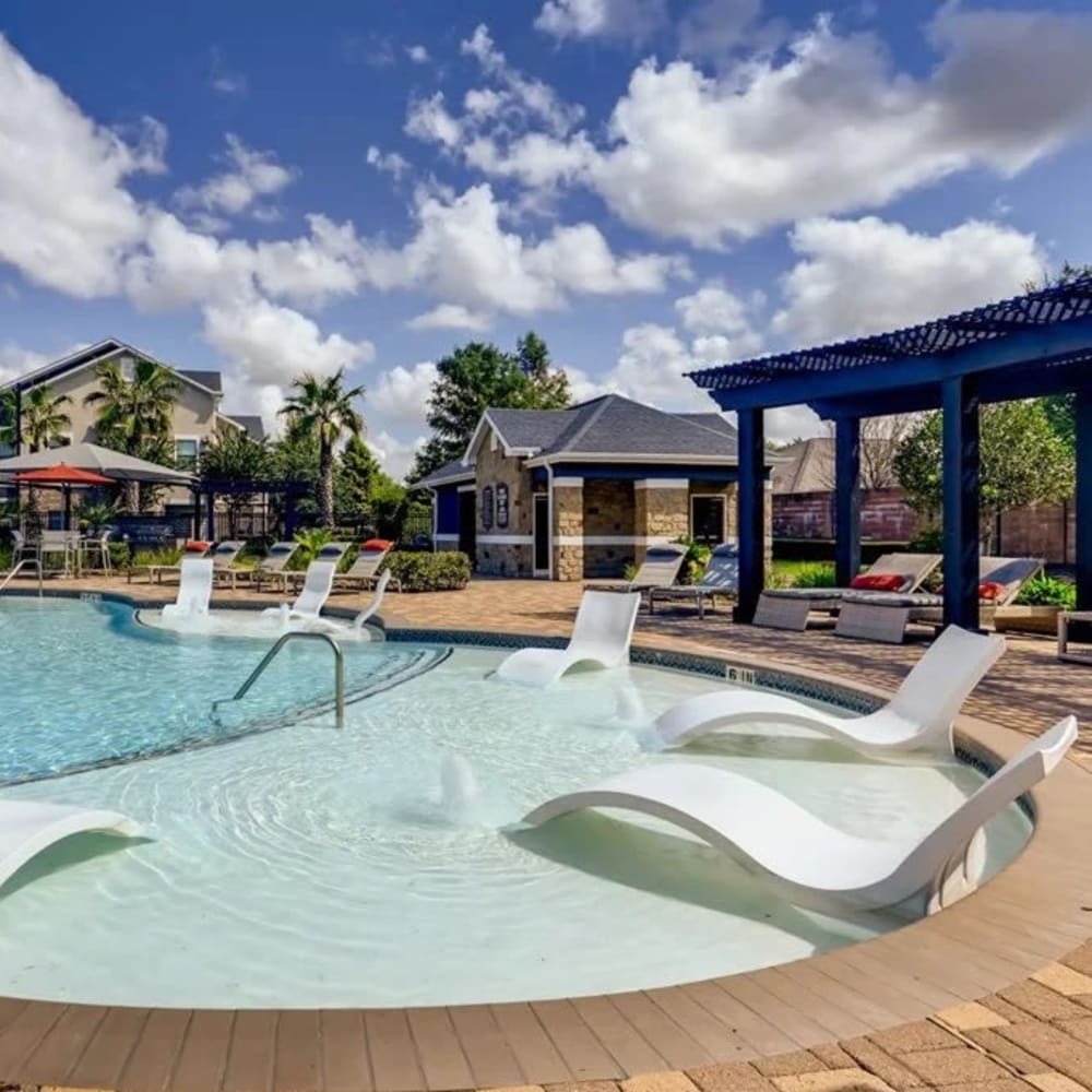 Pool and outdoor lounge at Avenues at Shadow Creek Ranch in Pearland, Texas