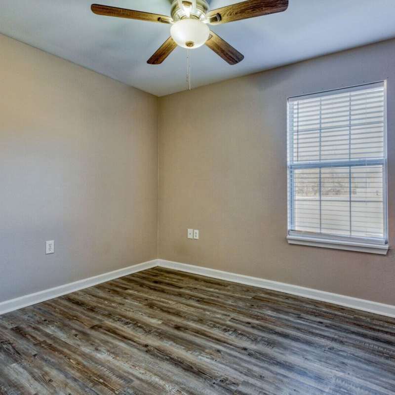 Unfurnished bedroom with window at Boomer Creek Apartments in Stillwater, Oklahoma