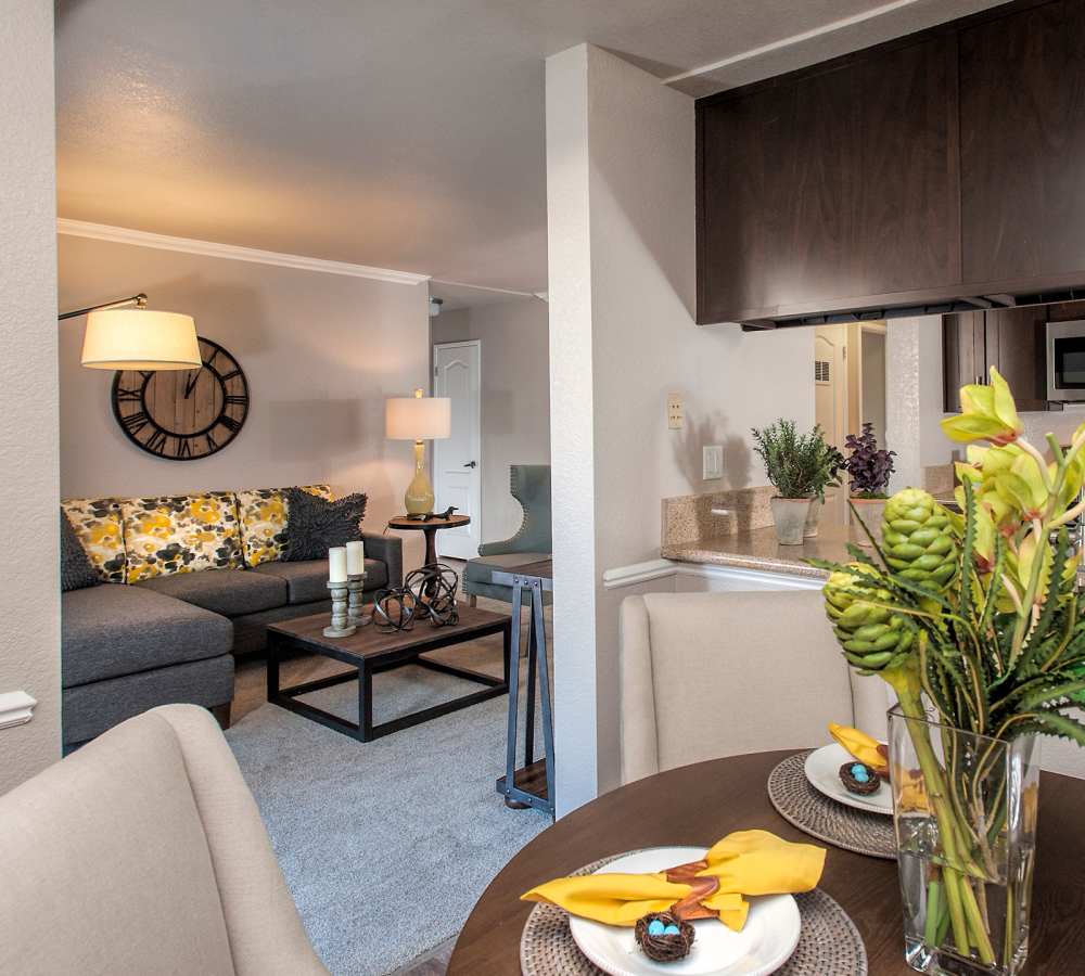 A spacious living room with upgraded finishes and breakfast bar at Deer Valley Apartment Homes in Roseville, California