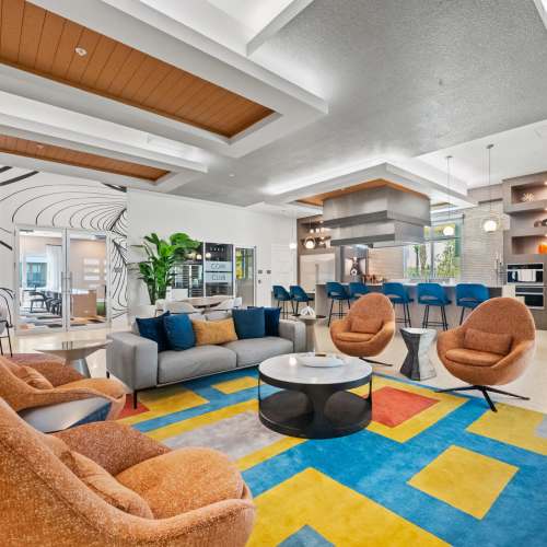 A circle of comfortable chairs in the clubhouse at Addison Square in Viera, Florida