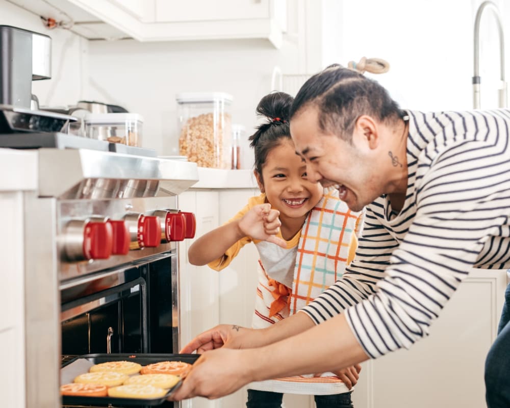A resident baking with his daughter at Stanley Court in Portsmouth, Virginia