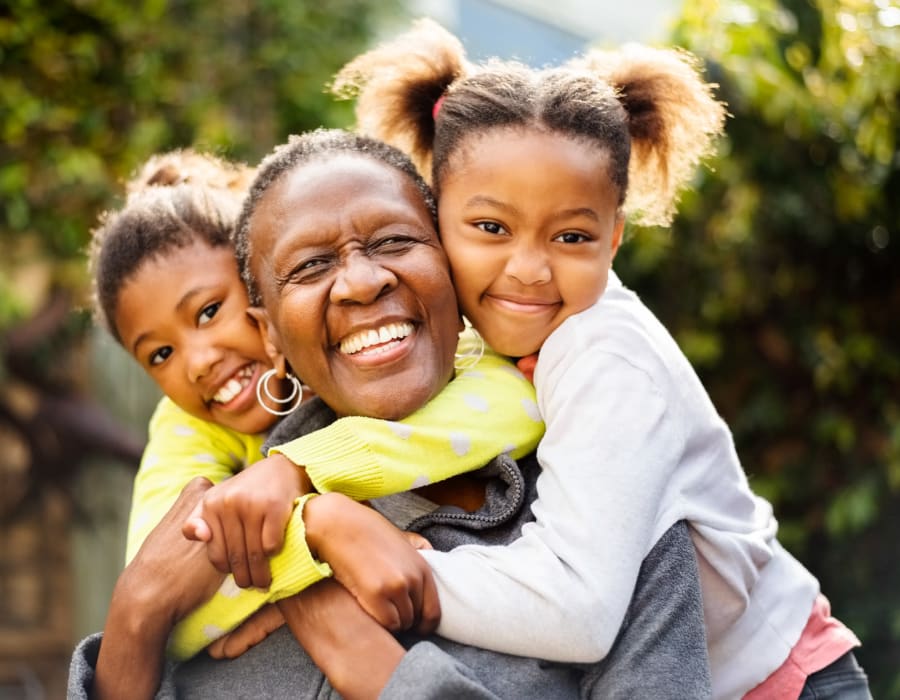 Resident with her grandchildren at The Club at Lake Wales in Lake Wales, Florida