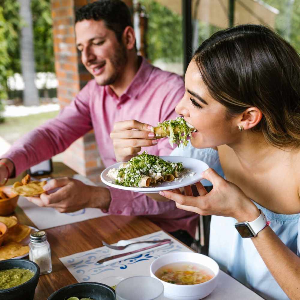 Residents enjoying their favorite food at a restaurant nearby Clairewood Apartments in Saint Clair, Michigan