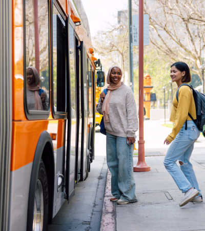 Students boarding a bus near Granada Gardens Apartments in Warrensville Heights, Ohio