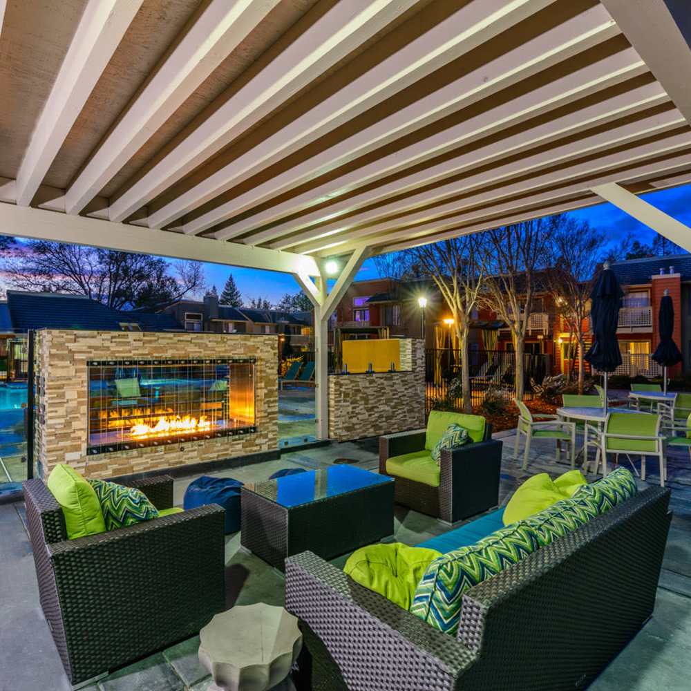 Patio seating with firepit at Crossbrook Apartments in Rohnert Park, California