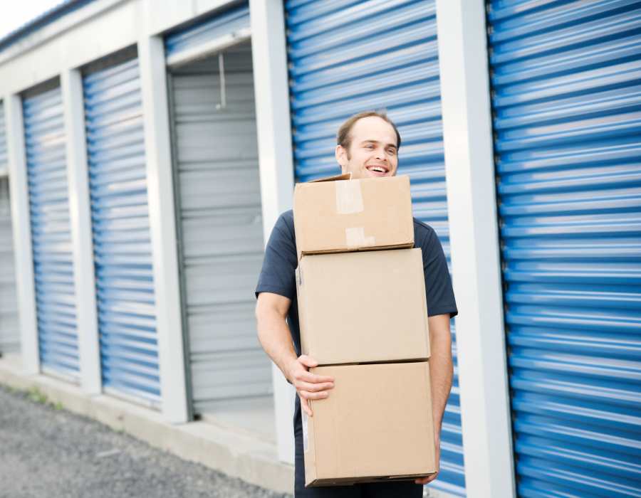 Person carrying boxes at Storage Hub - Sonterra in San Antonio, Texas