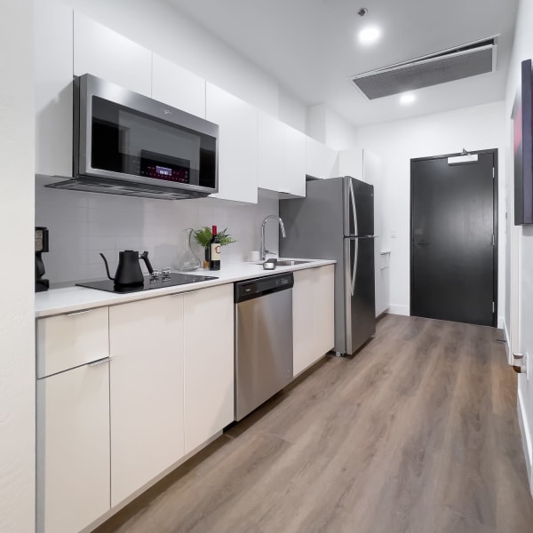 Luxury Kitchen with nice wood style flooring at The Charleston Apartments in Phoenix, Arizona