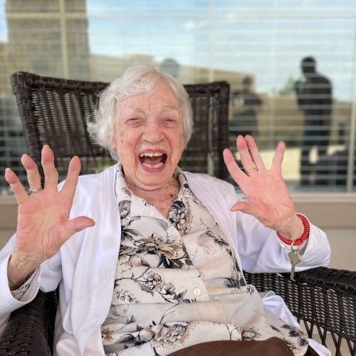 Resident and caretaker embracing at Saddlebrook Oxford Memory Care in Frisco, Texas