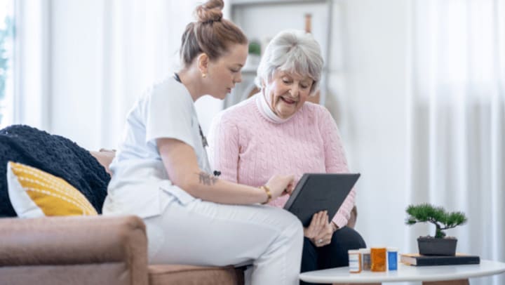 Home Care assistance helping with medications for senior client