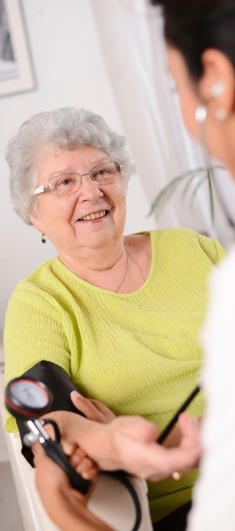 Resident having her blood pressure taken at Retirement Ranch in Clovis, New Mexico