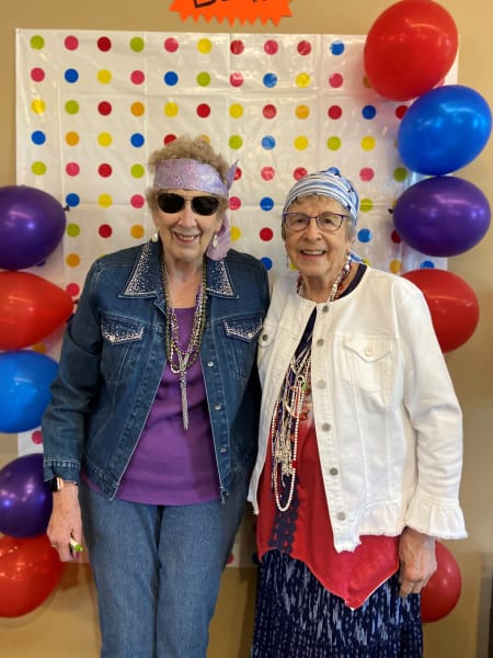 Two Tacoma residents strike a pose in the photo booth for Hippie Day!