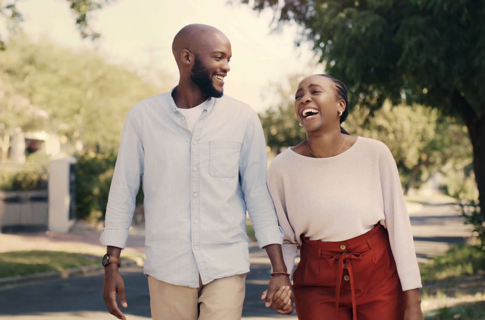 A couple enjoying each other's company at city street at Flatiron District at Austin Ranch, The Colony, Texas