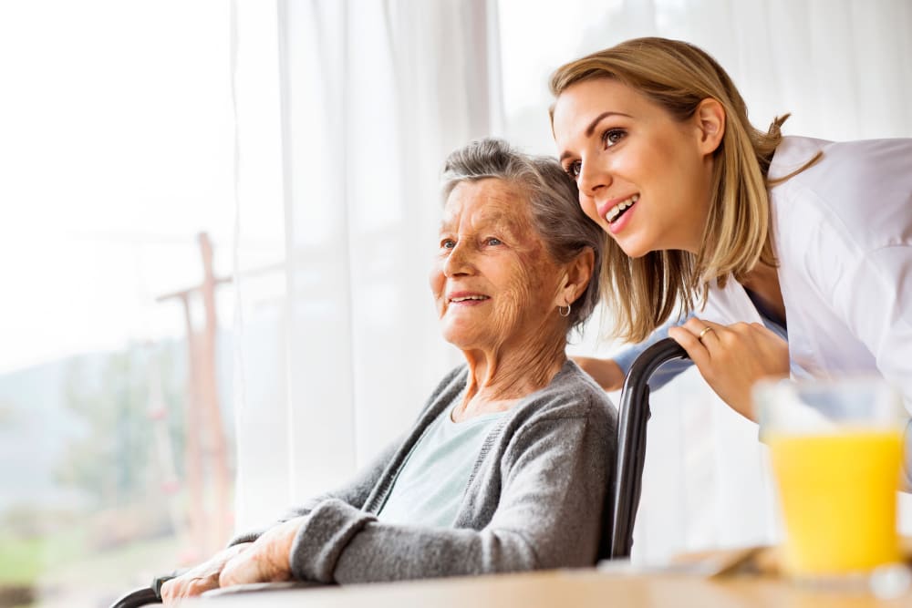 A senior resident looking on with a younger woman at her side at Regency Palms Colton in Colton, California.