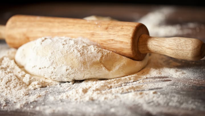 Floured pizza dough and a rolling pin at a pizzeria near Olympus at the District in South Jordan, Utah