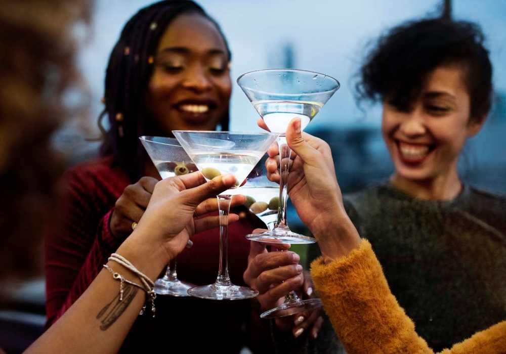 Friends enjoying drinks together at a local spot near North Road Townhomes in Scottsville, New York