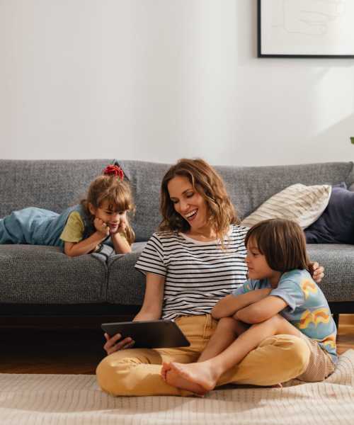 Resident having fun in their living room at Village at First in Gilroy, California
