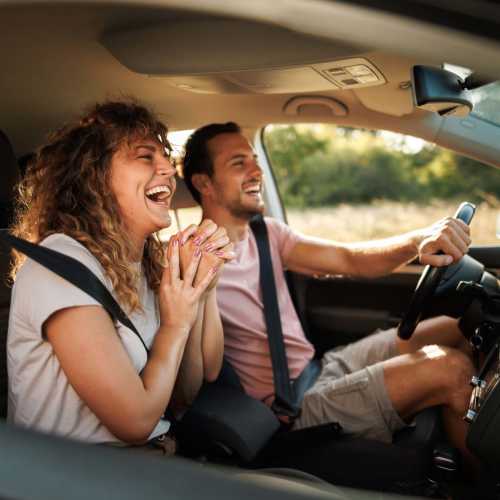 Happy couple out on a drive, in a car near The Meadows in Sparks, Nevada