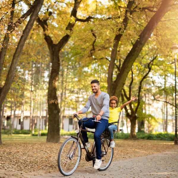 Father and daughter taking a ride at The Abbey at Spring Town Center in Spring, Texas