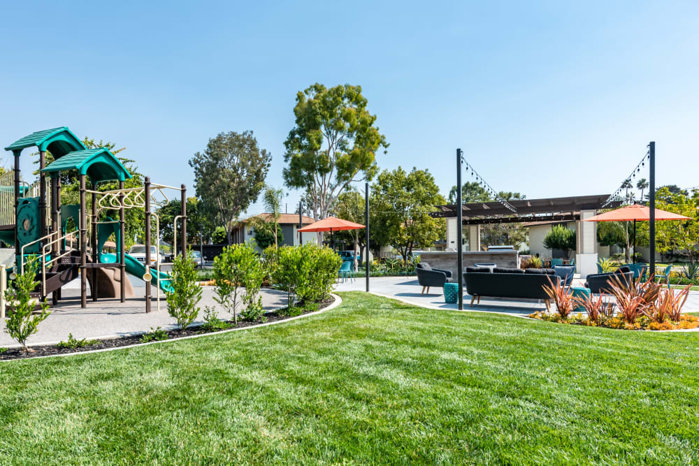 Children's playground and a grilling pavilion with patio seating at Sofi Ventura in Ventura, California