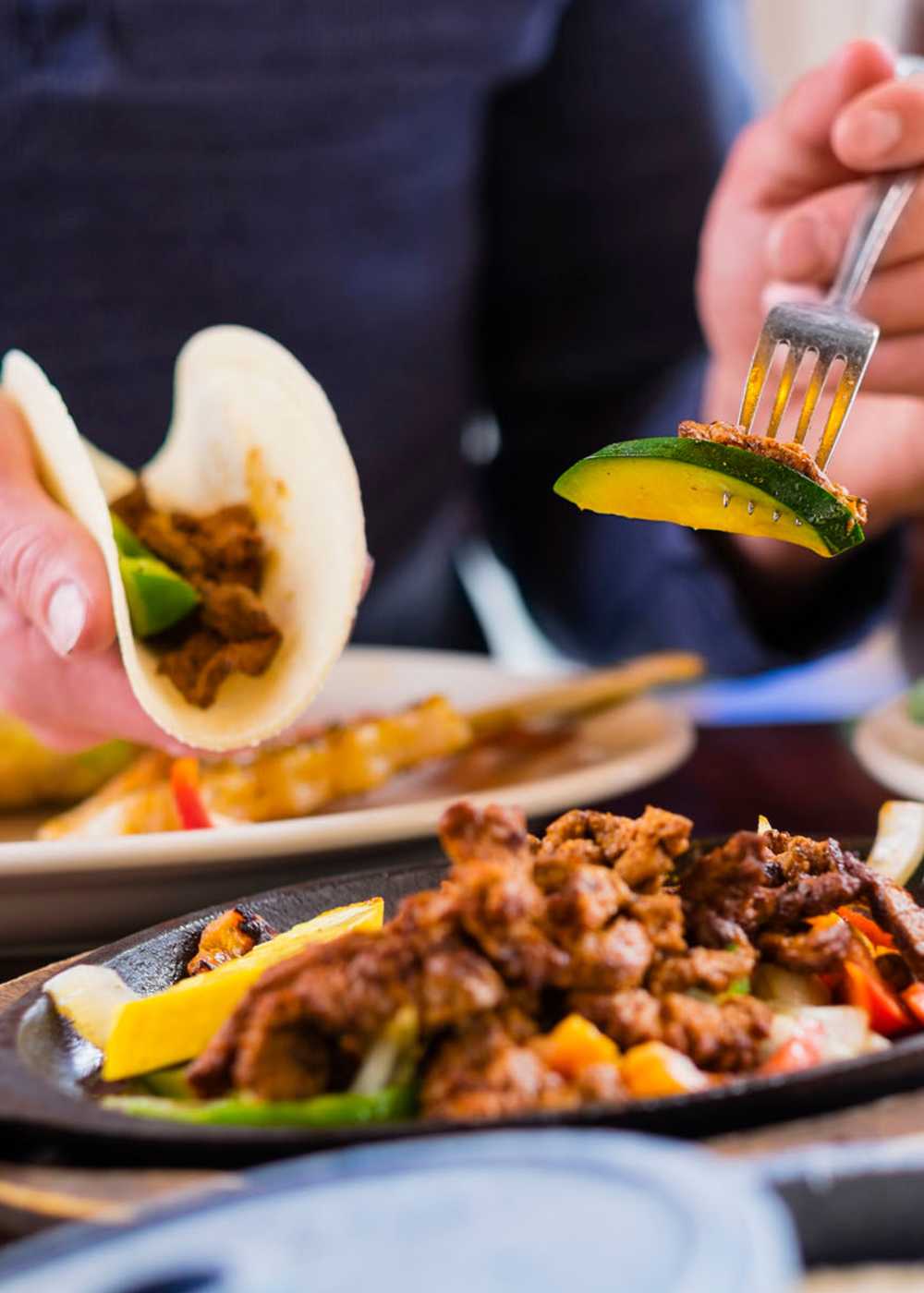 Resident having lunch at restaurant near Hawthorne Hill Apartments in Thornton, Colorado