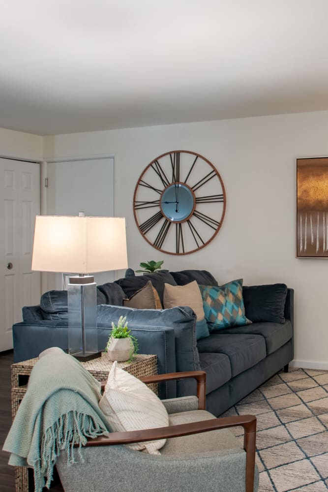 Model living room with wall-to-wall carpeting at Chesterfield Apartment Homes in Levittown, Pennsylvania