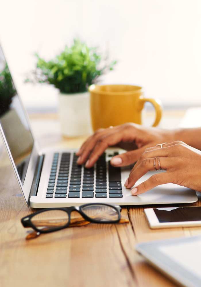 Person typing on computer at LivRed in Lincoln, Nebraska