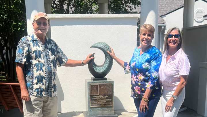 Steve Geczy, Diane Carr and Alicia Badger with the Shoreline sculpture